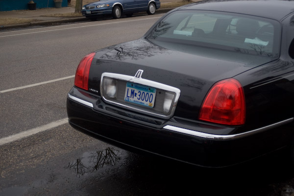 Limousine with a license plate that says LM3000