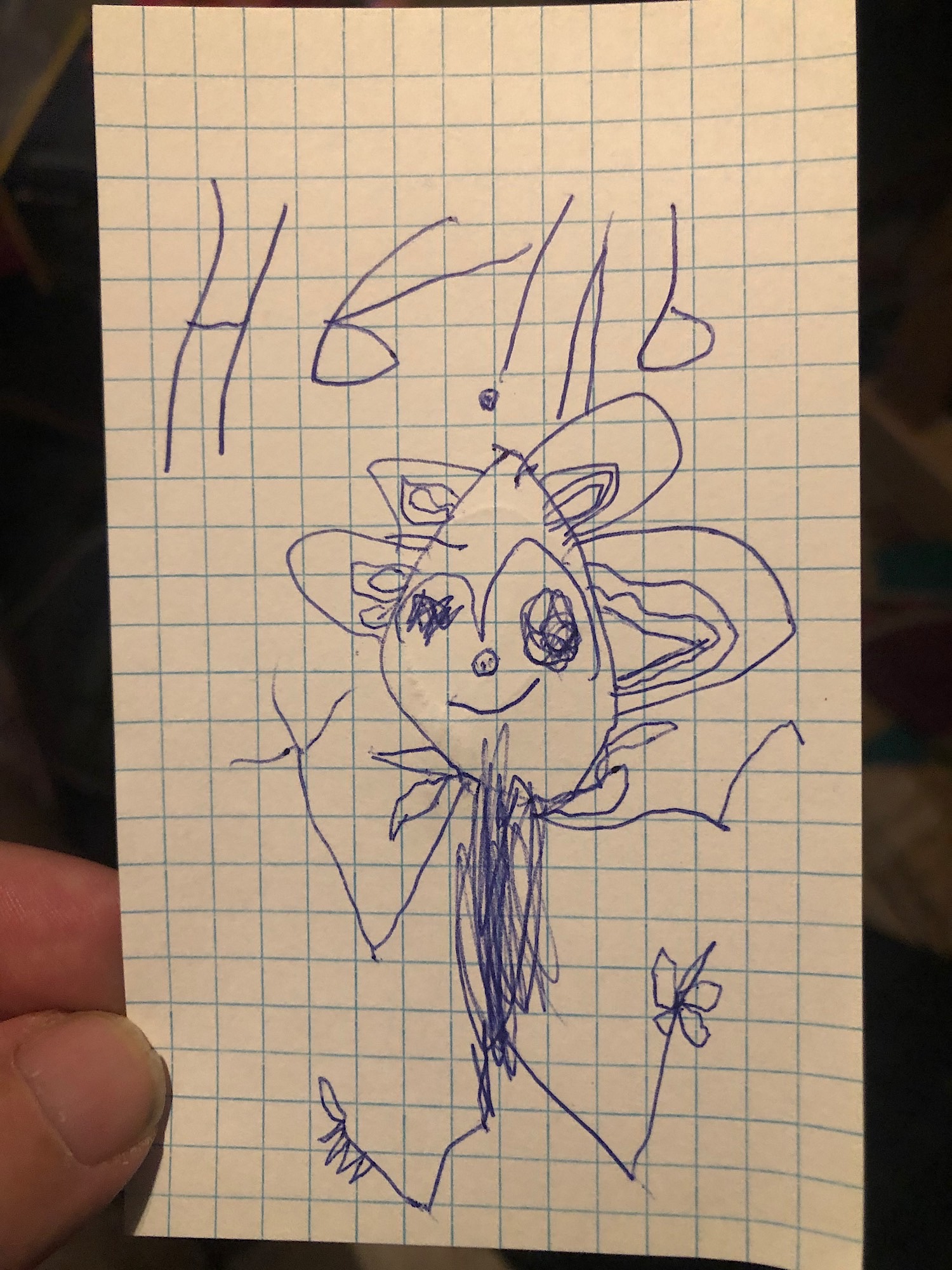 A child’s stick drawing of an evil girl with four ears